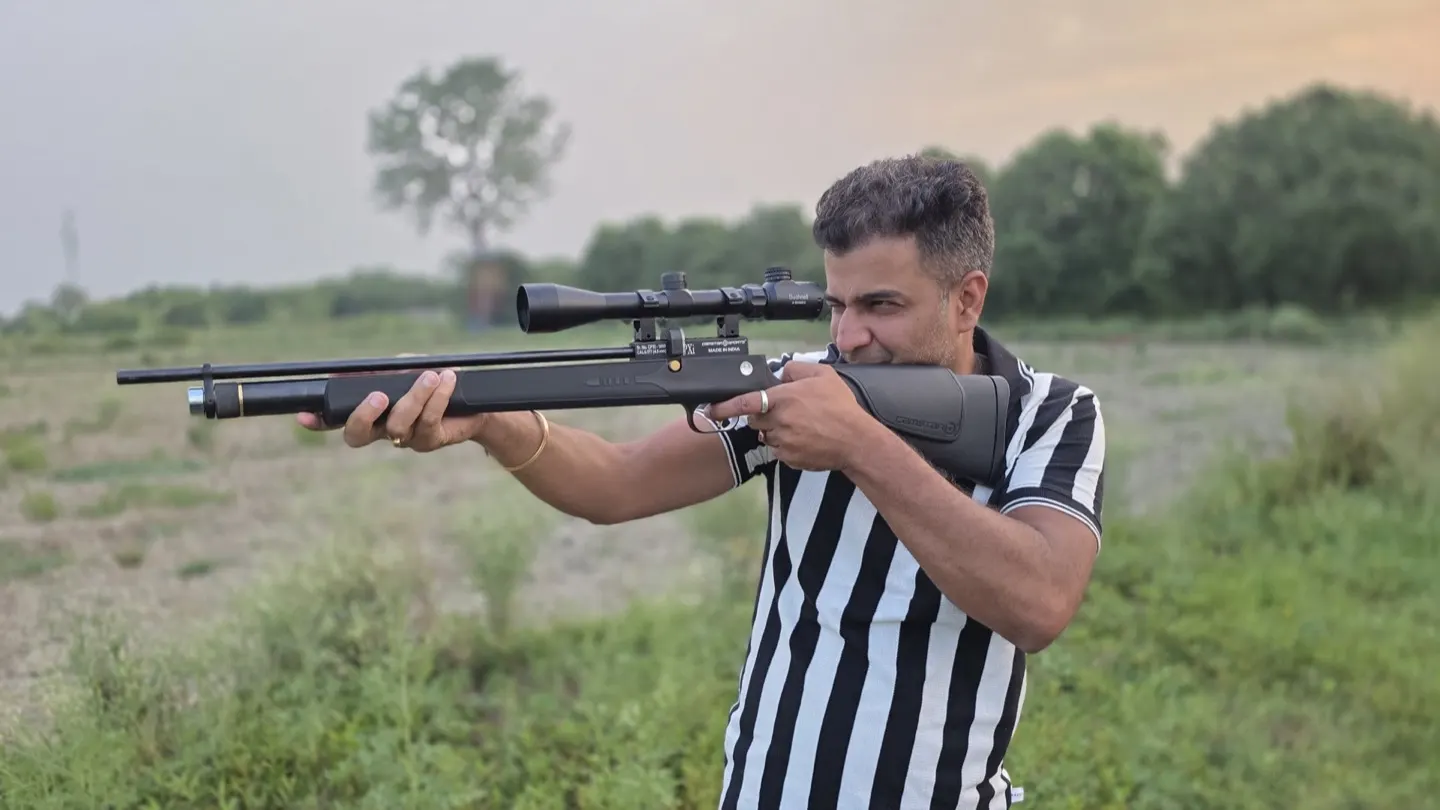 Air rifle practice on the field at dusk